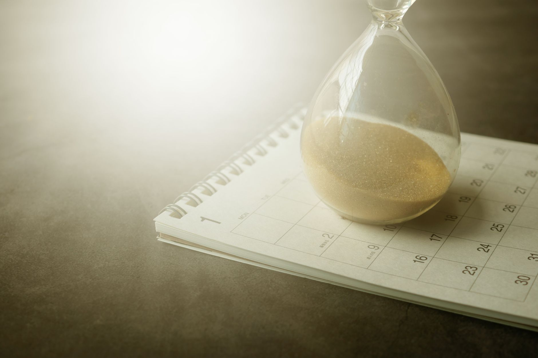 Hourglass representing how long staffing agency background checks take to complete